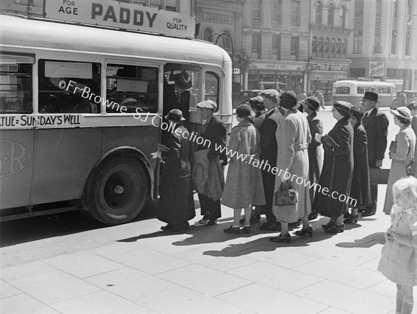 PATRICK STREET WITH SUNDAY'S WELL BUS PADDY'S ADVERT